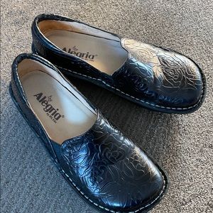 Alegria black slip ons